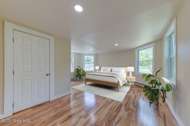 3956 Rte 9 W, Saugerties, NY 12477 - bedroom featuring light wood-style flooring, baseboards, multiple windows, and recessed lighting