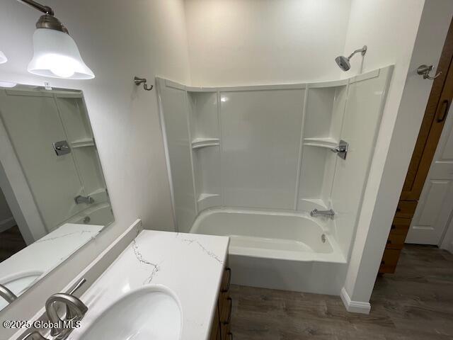 3916 State Highway 2, Brunswick, NY 12180 - bathroom featuring wood finished floors, shower / washtub combination, and vanity