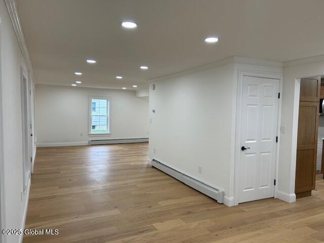3916 State Highway 2, Brunswick, NY 12180 - empty room featuring baseboard heating, crown molding, light wood finished floors, recessed lighting, and baseboards