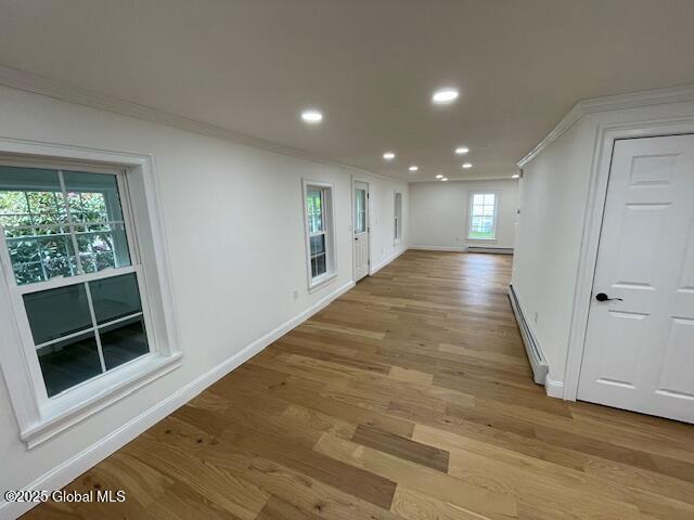 3916 State Highway 2, Brunswick, NY 12180 - hallway featuring crown molding, a baseboard radiator, recessed lighting, light wood-style floors, and baseboards