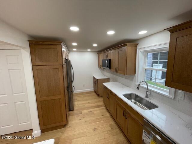 3916 State Highway 2, Brunswick, NY 12180 - kitchen with a sink, appliances with stainless steel finishes, light wood-type flooring, baseboards, and recessed lighting