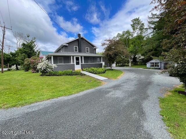 3916 State Highway 2, Brunswick, NY 12180 - bungalow-style home with a chimney, a sunroom, and a front lawn