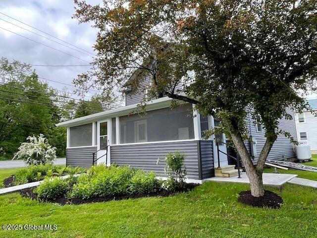 3916 State Highway 2, Brunswick, NY 12180 - view of front of property featuring a sunroom and a front yard
