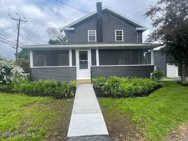 3916 State Highway 2, Brunswick, NY 12180 - view of front facade featuring a sunroom and a front yard