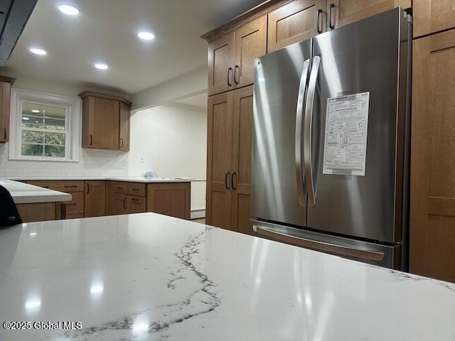 3916 State Highway 2, Brunswick, NY 12180 - kitchen featuring freestanding refrigerator, brown cabinetry, recessed lighting, and light countertops