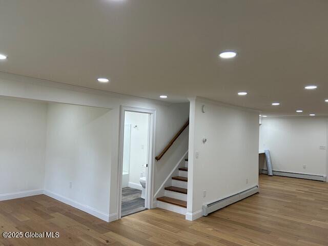 3916 State Highway 2, Brunswick, NY 12180 - finished below grade area with baseboard heating, wood finished floors, recessed lighting, stairs, and baseboards
