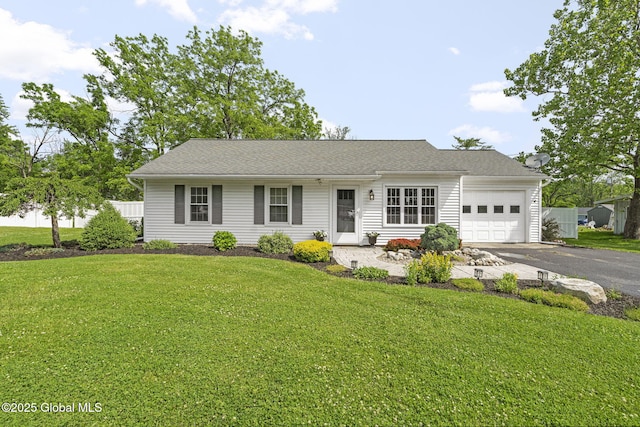 11 Thatcher Dr, Altamont, NY 12009 - view of front of house featuring an attached garage, driveway, and a front lawn