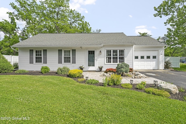 11 Thatcher Dr, Altamont, NY 12009 - view of front of house featuring a garage, asphalt driveway, and a shingled roof