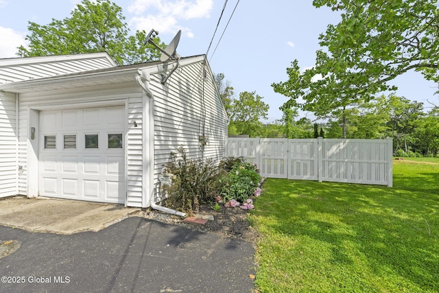 11 Thatcher Dr, Altamont, NY 12009 - view of home's exterior with a garage and driveway