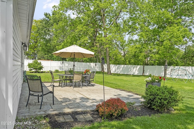 11 Thatcher Dr, Altamont, NY 12009 - fenced backyard with a patio