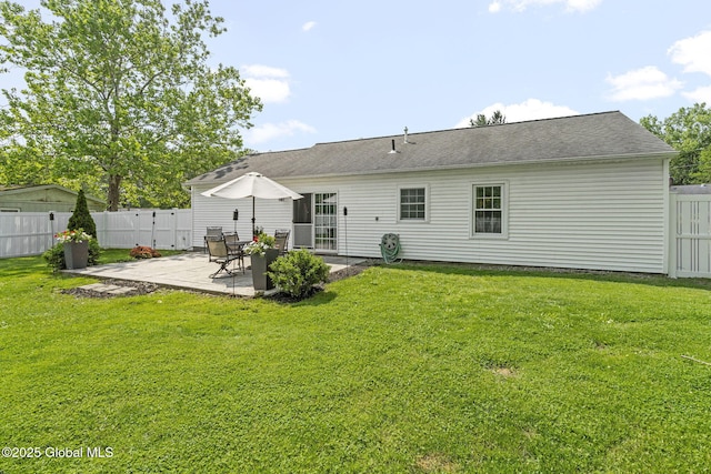 11 Thatcher Dr, Altamont, NY 12009 - rear view of property featuring a patio, a fenced backyard, and roof with shingles