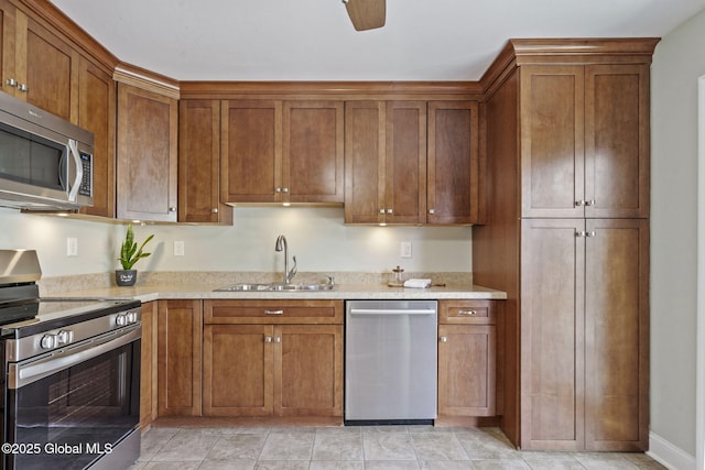 11 Thatcher Dr, Altamont, NY 12009 - kitchen featuring appliances with stainless steel finishes and brown cabinetry