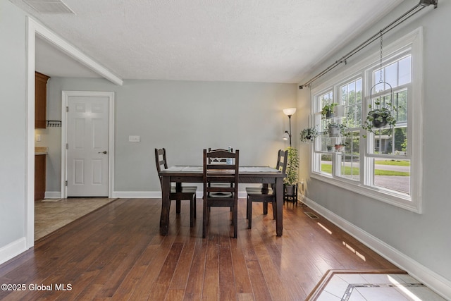 11 Thatcher Dr, Altamont, NY 12009 - dining space with dark wood-type flooring and a textured ceiling
