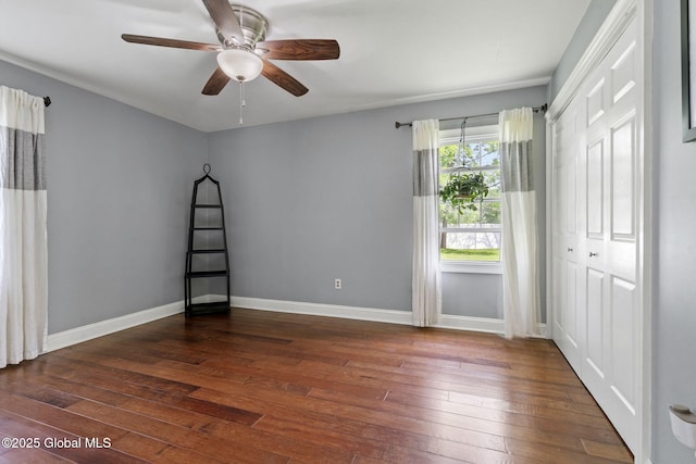 11 Thatcher Dr, Altamont, NY 12009 - unfurnished bedroom with dark wood-style floors, a closet, and ceiling fan