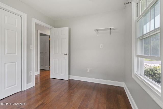 11 Thatcher Dr, Altamont, NY 12009 - empty room featuring dark wood-type flooring and plenty of natural light