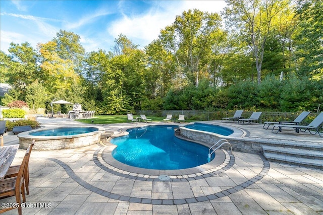 18 Rose Ter, Wilton, NY 12866 - view of swimming pool with a pool with connected hot tub, a patio, and view of scattered trees