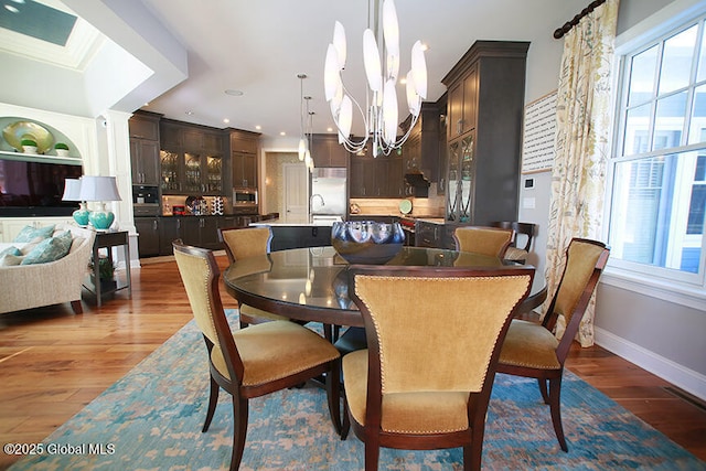 18 Rose Ter, Wilton, NY 12866 - dining room with a chandelier, wood finished floors, baseboards, and recessed lighting