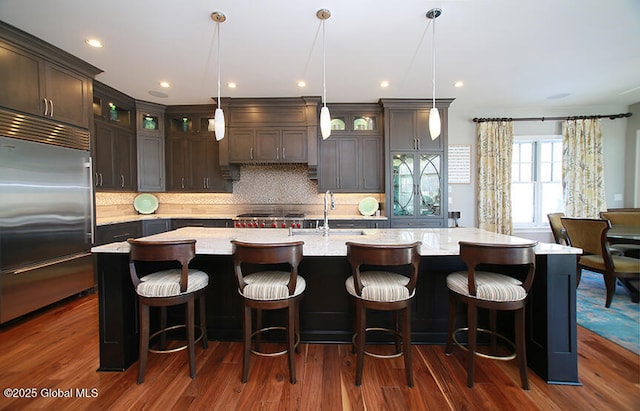 18 Rose Ter, Wilton, NY 12866 - kitchen with built in refrigerator, a sink, dark brown cabinetry, dark wood-type flooring, and recessed lighting