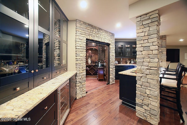 18 Rose Ter, Wilton, NY 12866 - indoor wet bar with beverage cooler, wood-type flooring, and decorative columns