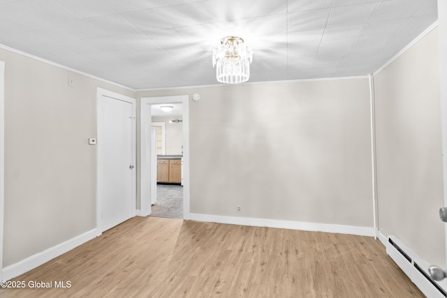 819 1st St, Rensselaer, NY 12144 - unfurnished room featuring a baseboard heating unit, crown molding, wood finished floors, a chandelier, and baseboards