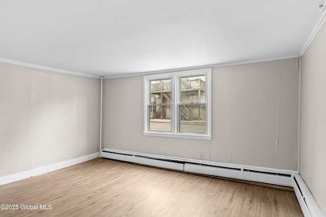 819 1st St, Rensselaer, NY 12144 - unfurnished room featuring wood finished floors, baseboard heating, ornamental molding, and baseboards