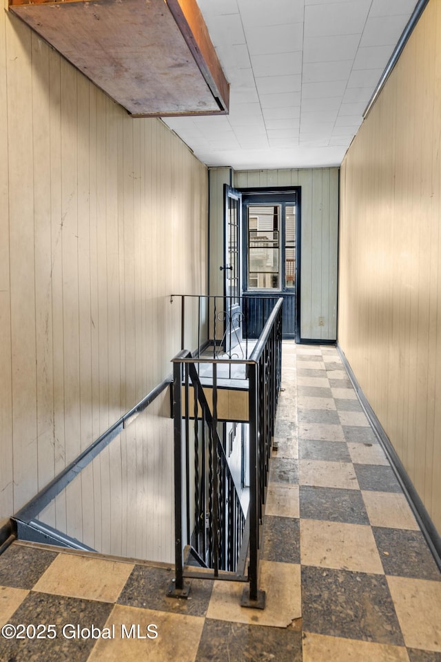 819 1st St, Rensselaer, NY 12144 - hallway with tile patterned floors and wooden walls