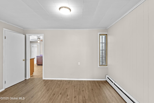 819 1st St, Rensselaer, NY 12144 - unfurnished room with baseboard heating, wood finished floors, crown molding, baseboards, and a ceiling fan