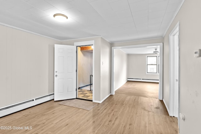 819 1st St, Rensselaer, NY 12144 - unfurnished room with a baseboard radiator, light wood-style floors, ornamental molding, and baseboards