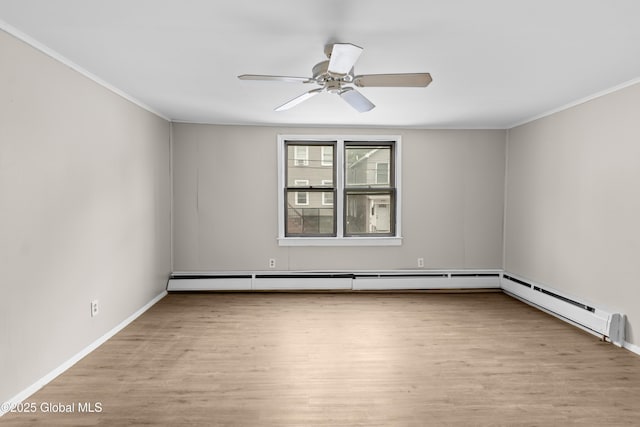 819 1st St, Rensselaer, NY 12144 - spare room with wood finished floors, ornamental molding, a ceiling fan, baseboards, and baseboard heating