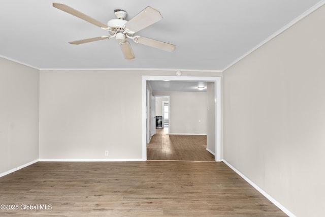 819 1st St, Rensselaer, NY 12144 - spare room with ornamental molding, wood finished floors, baseboards, and a ceiling fan