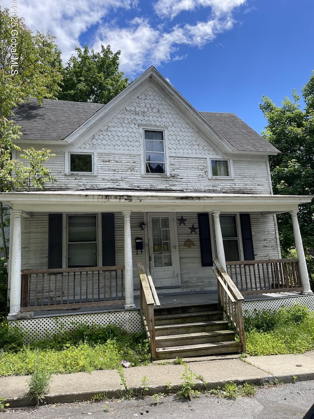 6 Clayton St, Amsterdam, NY 12010 - view of front of home with a porch and roof with shingles