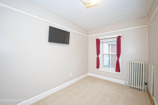 1013 Washington Ave, Albany, NY 12206 - empty room featuring radiator heating unit, baseboards, and carpet flooring