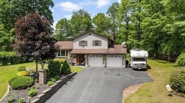 617 Cindy Ln, Ballston, NY 12020 - split level home featuring a front lawn, asphalt driveway, a garage, and a chimney