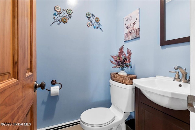 617 Cindy Ln, Ballston, NY 12020 - bathroom with a baseboard heating unit, toilet, and vanity