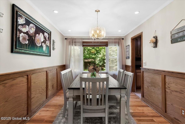 617 Cindy Ln, Ballston, NY 12020 - dining area featuring wainscoting, light wood-type flooring, a chandelier, recessed lighting, and ornamental molding