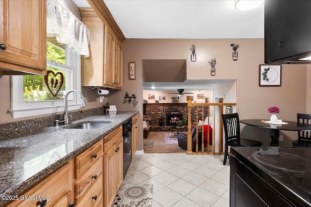 617 Cindy Ln, Ballston, NY 12020 - kitchen with a sink, black dishwasher, a ceiling fan, light tile patterned flooring, and dark stone countertops