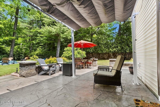 617 Cindy Ln, Ballston, NY 12020 - view of patio with outdoor dining space and an outdoor fire pit
