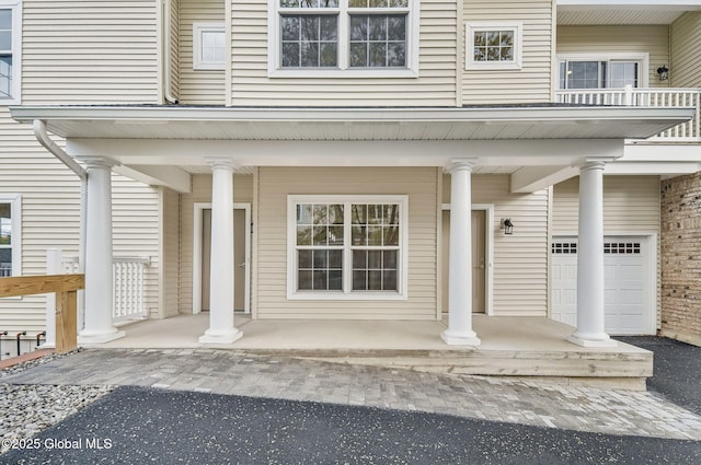 601 Vly Pointe Dr, Niskayuna, NY 12309 - property entrance featuring covered porch and a garage