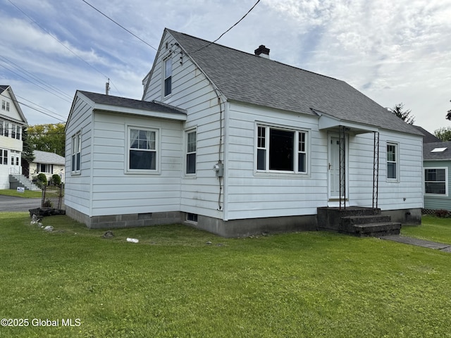 46 Elmhurst Ave, Albany, NY 12203 - view of front of property featuring a front lawn, a shingled roof, and a chimney