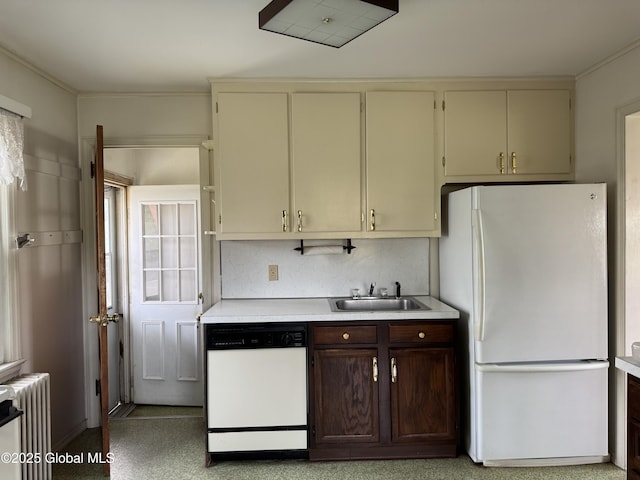 46 Elmhurst Ave, Albany, NY 12203 - kitchen with white appliances, radiator, a sink, light countertops, and cream cabinetry
