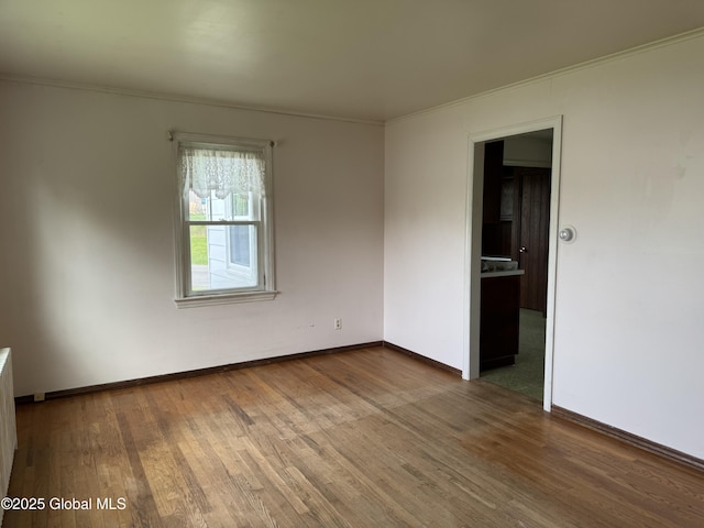 46 Elmhurst Ave, Albany, NY 12203 - unfurnished room featuring wood finished floors, ornamental molding, and baseboards
