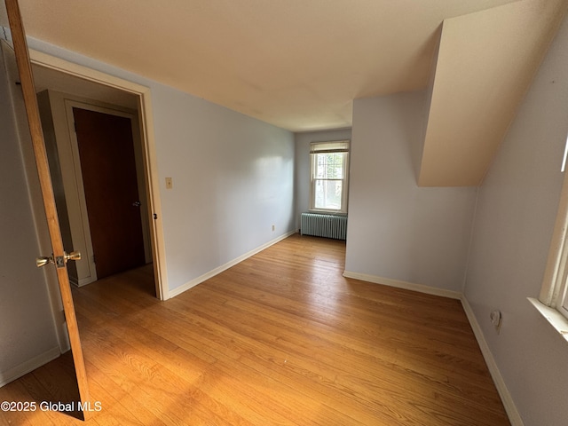 46 Elmhurst Ave, Albany, NY 12203 - unfurnished room with radiator, light wood finished floors, and baseboards
