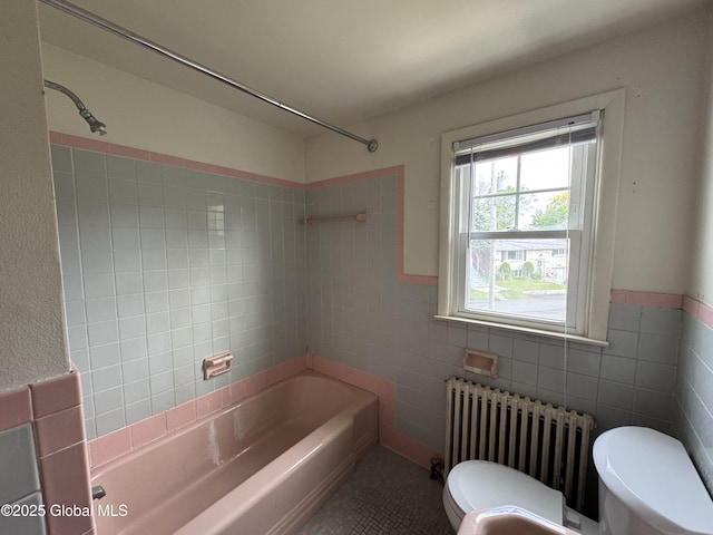 46 Elmhurst Ave, Albany, NY 12203 - bathroom with radiator, toilet, tile walls, bathtub / shower combination, and wainscoting