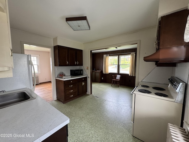 46 Elmhurst Ave, Albany, NY 12203 - kitchen with white appliances, a sink, dark brown cabinets, and light countertops