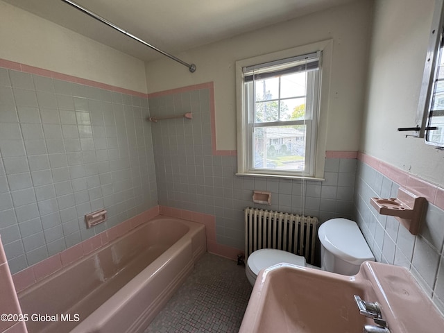 46 Elmhurst Ave, Albany, NY 12203 - full bathroom featuring radiator, toilet, tile walls, shower / bath combination, and tile patterned floors