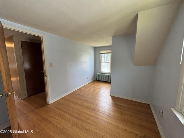 46 Elmhurst Ave, Albany, NY 12203 - unfurnished room featuring radiator heating unit, light wood finished floors, and baseboards