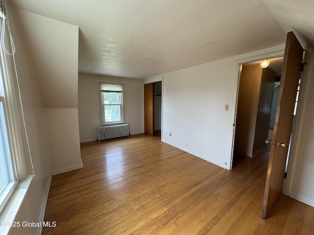 46 Elmhurst Ave, Albany, NY 12203 - unfurnished room with radiator, light wood-style floors, and baseboards