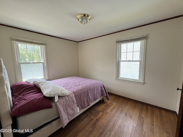 46 Elmhurst Ave, Albany, NY 12203 - bedroom featuring crown molding, multiple windows, wood finished floors, and baseboards