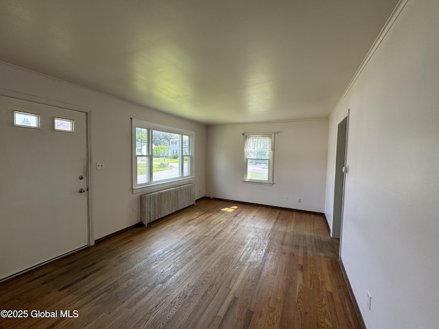 46 Elmhurst Ave, Albany, NY 12203 - entryway with radiator heating unit, wood finished floors, ornamental molding, and baseboards