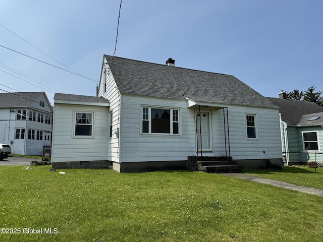 46 Elmhurst Ave, Albany, NY 12203 - view of front of home with a chimney, a front lawn, and roof with shingles